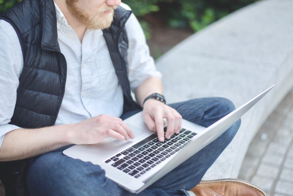 Person working on laptop in park